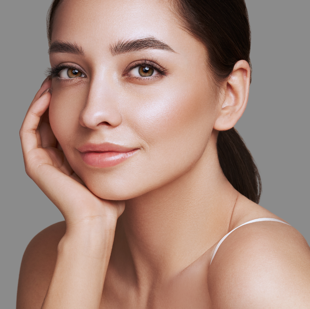 beautiful young woman touching her face