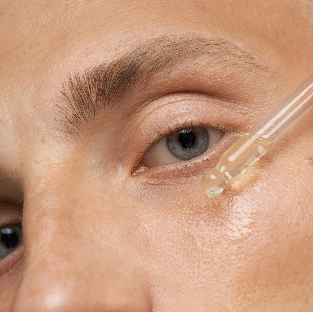 applying skincare to face